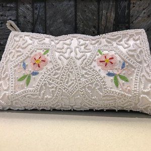 White beaded silk clutch with embroidery detail